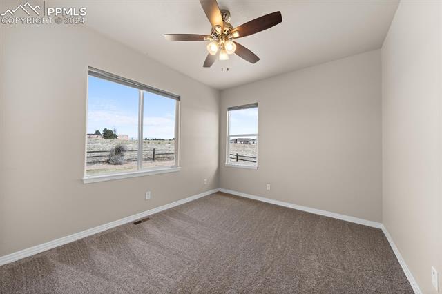 766 Struthers Ranch Road Colorado Springs, CO 80921 - Photo 12 of 40 The bedroom on the main level is perfect for guests or as an office