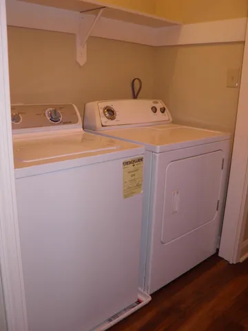 a utility room with sink dryer and washer