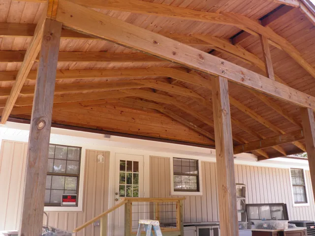 a view of a yard with large trees
