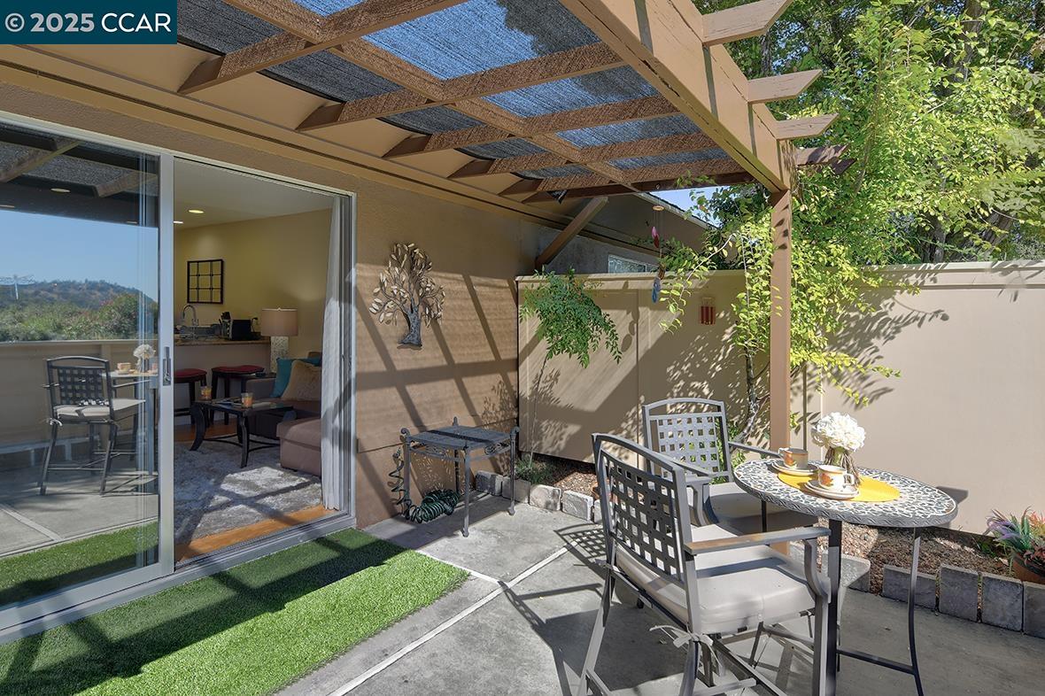 2148 Golden Rain Road, Unit 1 Walnut Creek, CA 94595 - Photo 13 of 48 a view of outdoor dining space with a patio