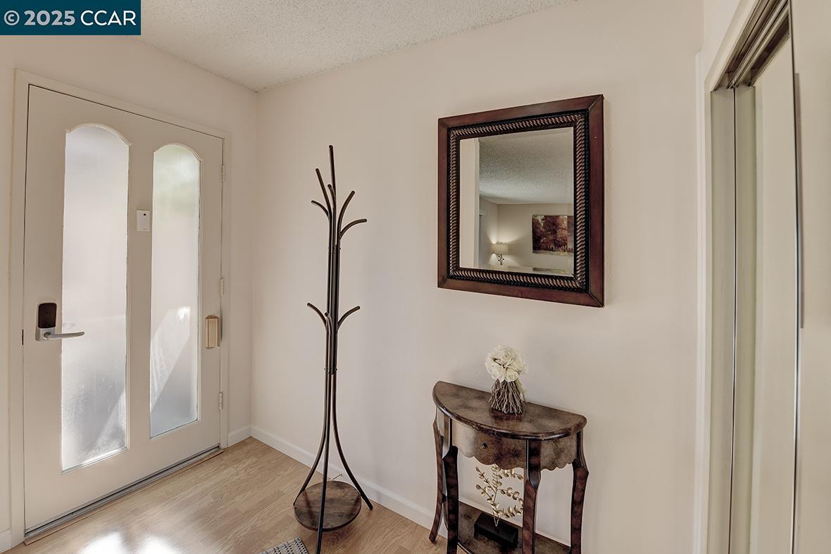 2148 Golden Rain Road, Unit 1 Walnut Creek, CA 94595 - Photo 33 of 48 a view of a workspace with furniture and wooden floor