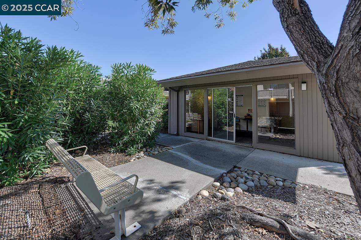 2148 Golden Rain Road, Unit 1 Walnut Creek, CA 94595 - Photo 34 of 48 a view of a patio with table and chairs and potted plants