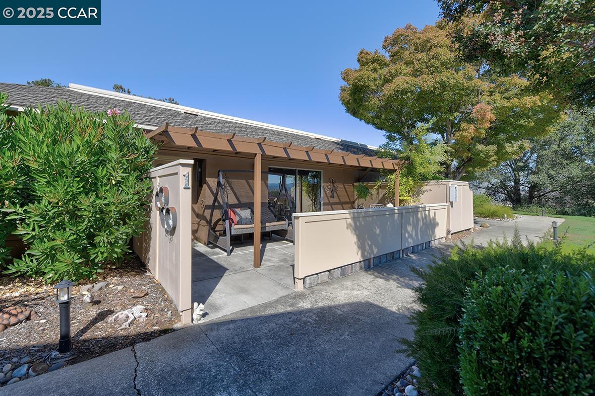 2148 Golden Rain Road, Unit 1 Walnut Creek, CA 94595 - Photo 5 of 48 a view of a patio with table and chairs and potted plants