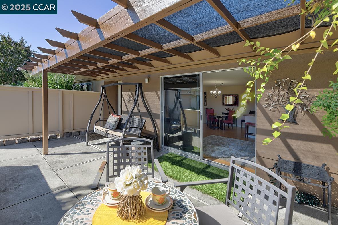 2148 Golden Rain Road, Unit 1 Walnut Creek, CA 94595 - Photo 7 of 48 a view of a backyard with table and chairs