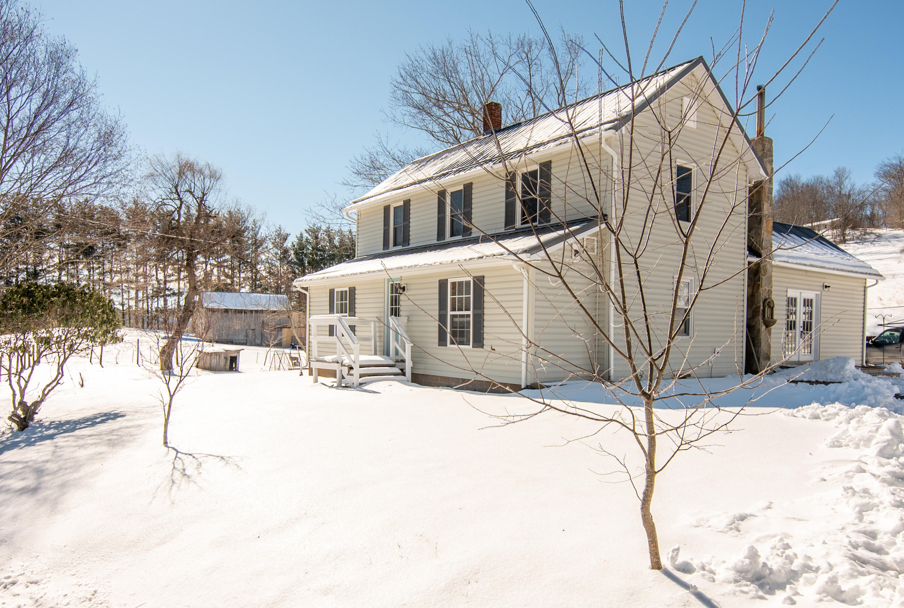 1696 Conner Grove Road Southwest Willis, VA 24380 - Photo 2 of 41 a view of a house with snow on the road