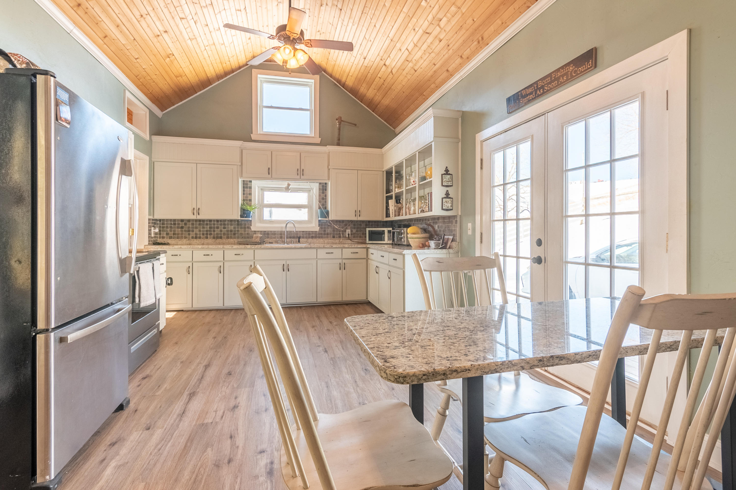1696 Conner Grove Road Southwest Willis, VA 24380 - Photo 13 of 41 a kitchen with stainless steel appliances granite countertop a stove top oven a sink and a refrigerator