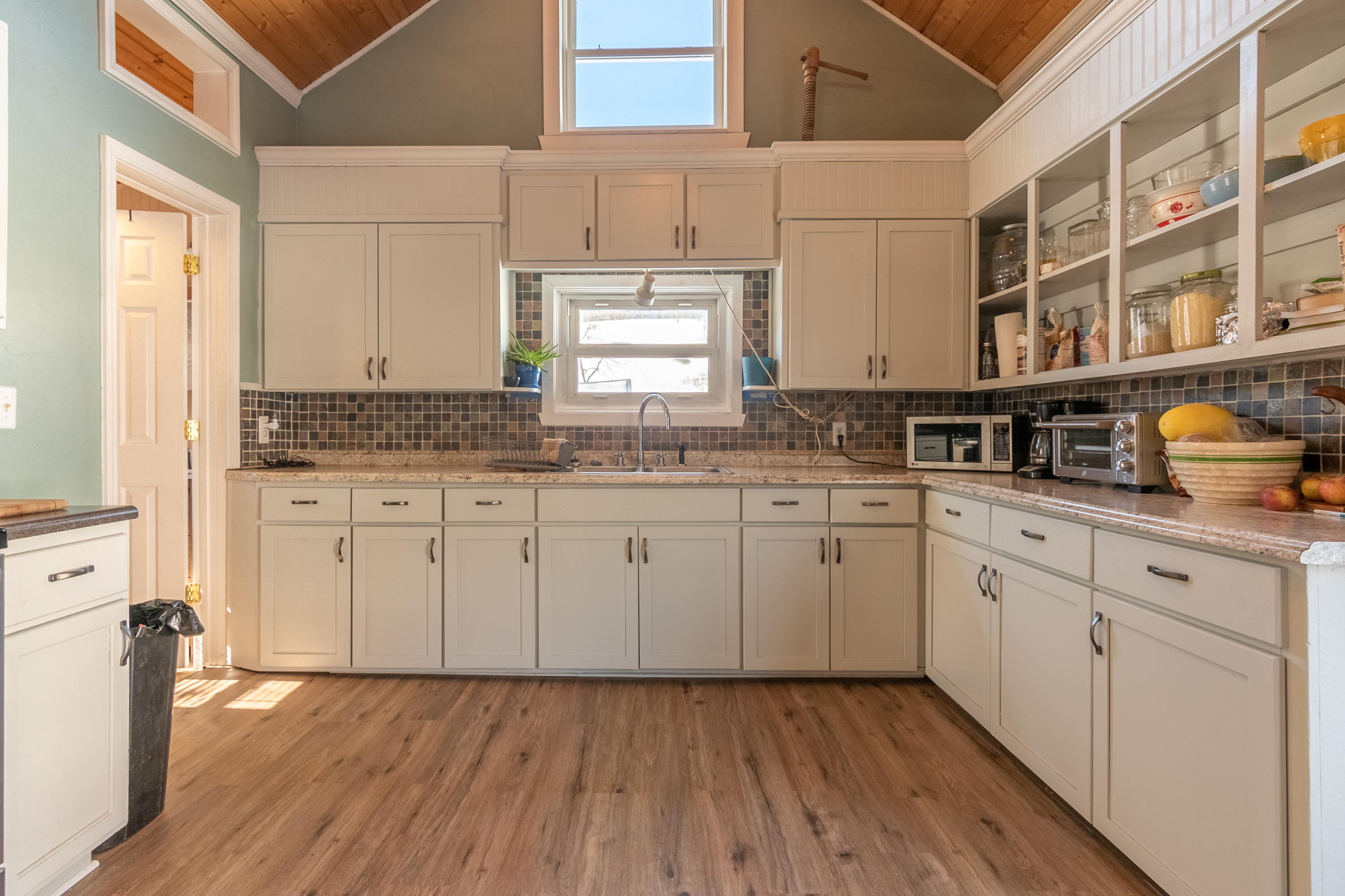 1696 Conner Grove Road Southwest Willis, VA 24380 - Photo 14 of 41 a kitchen with granite countertop white cabinets and white appliances