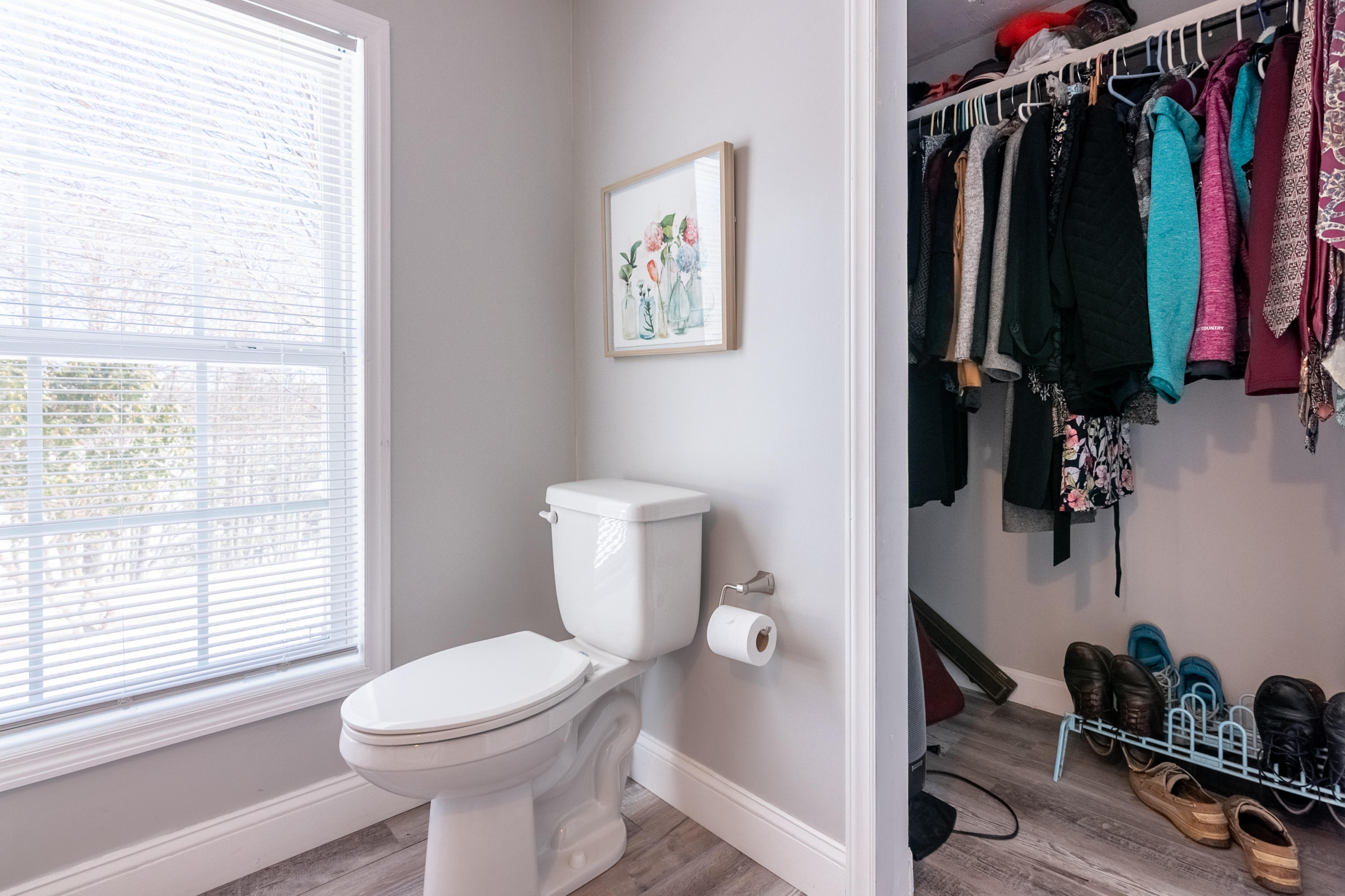 1696 Conner Grove Road Southwest Willis, VA 24380 - Photo 26 of 41 a bathroom with a toilet a sink and a window