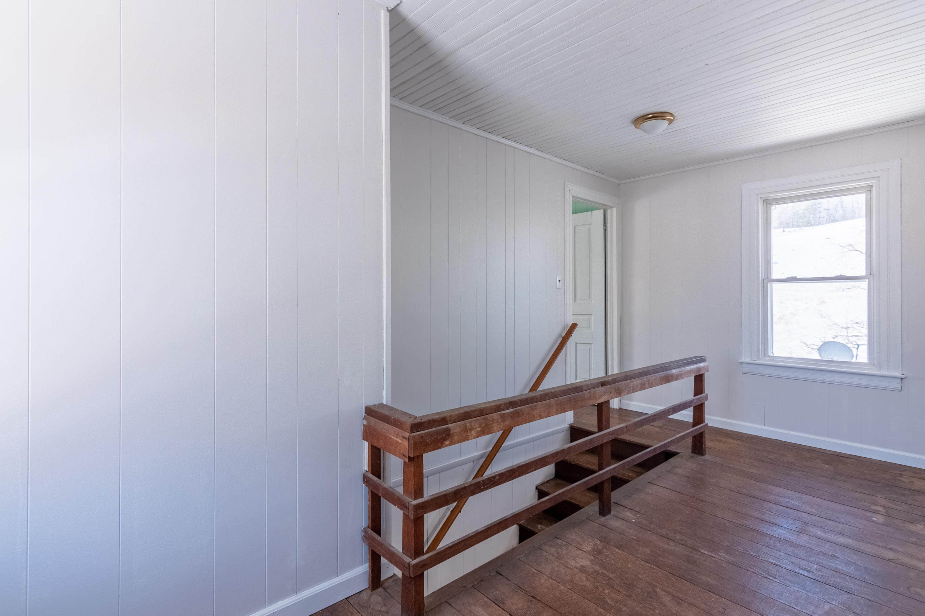 1696 Conner Grove Road Southwest Willis, VA 24380 - Photo 28 of 41 a view of a room with wooden floor and white walls