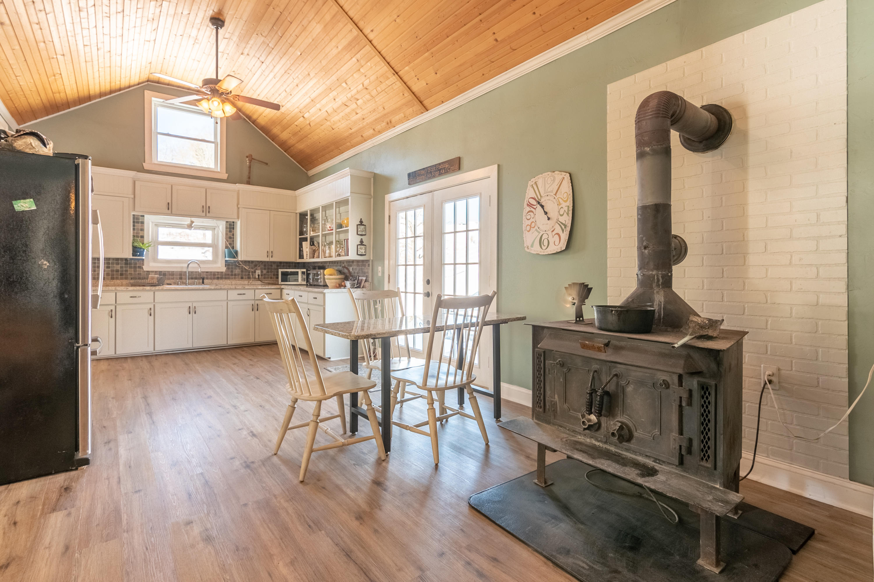 1696 Conner Grove Road Southwest Willis, VA 24380 - Photo 10 of 41 a kitchen with a stove and a wooden floor