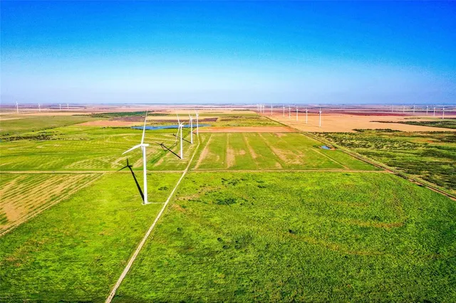 a view of an ocean & house
