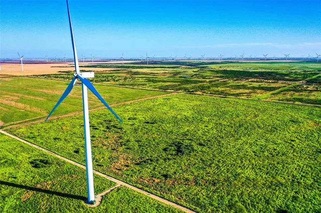 a view of an ocean & house in a yard