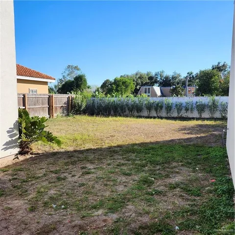 a view of a lake with houses in the background