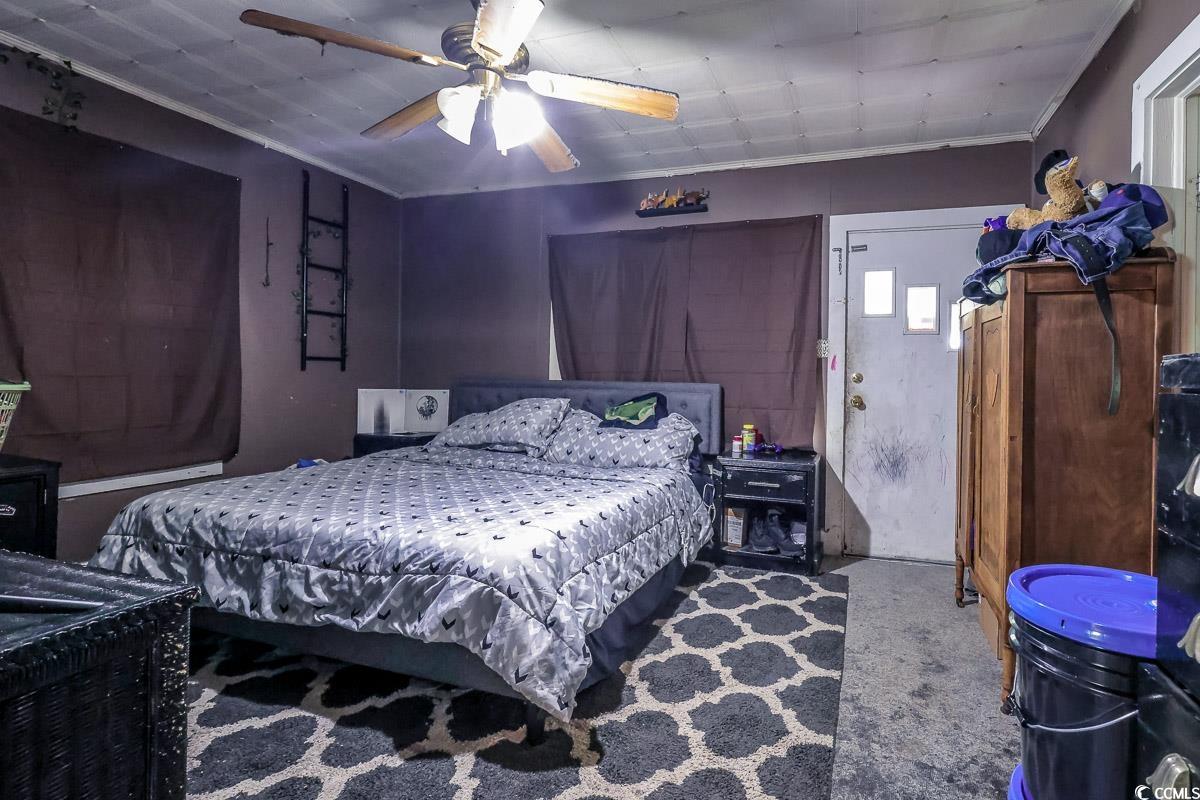213 North Magnolia Avenue Andrews, SC 29510 - Photo 3 of 20 Carpeted bedroom featuring ornamental molding and a ceiling fan