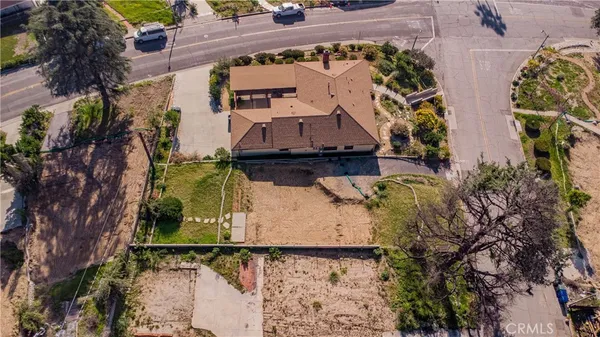 an aerial view of a house with a garden