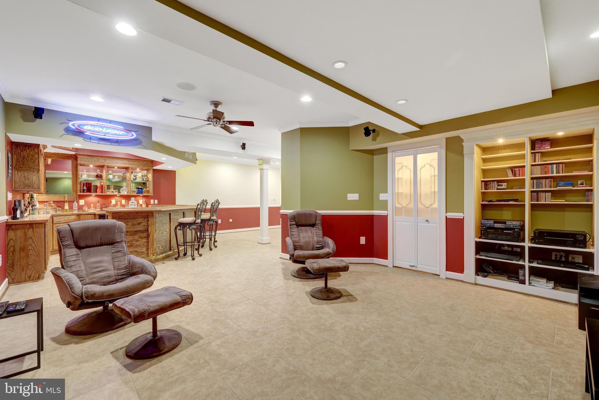 13650 Independence Ridge Nokesville, VA 20181 - Photo 52 of 98 Lower-Level Theater Room with Built-In Shelving