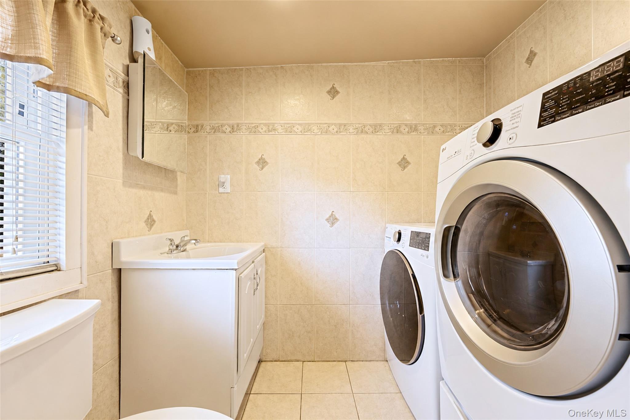 80 George Street Babylon, NY 11702 - Photo 17 of 41 a utility room with dryer and washer