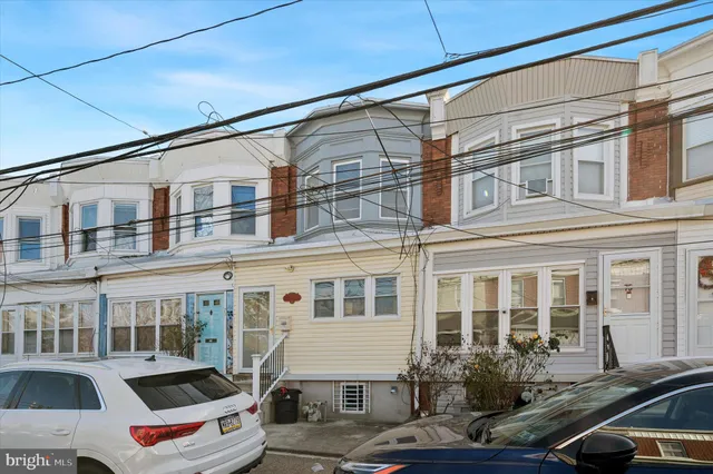 a front view of a building with lot of windows