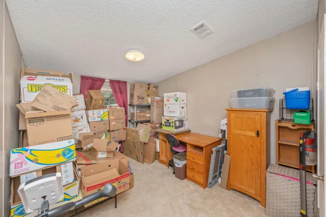 a room with furniture and a flat screen tv