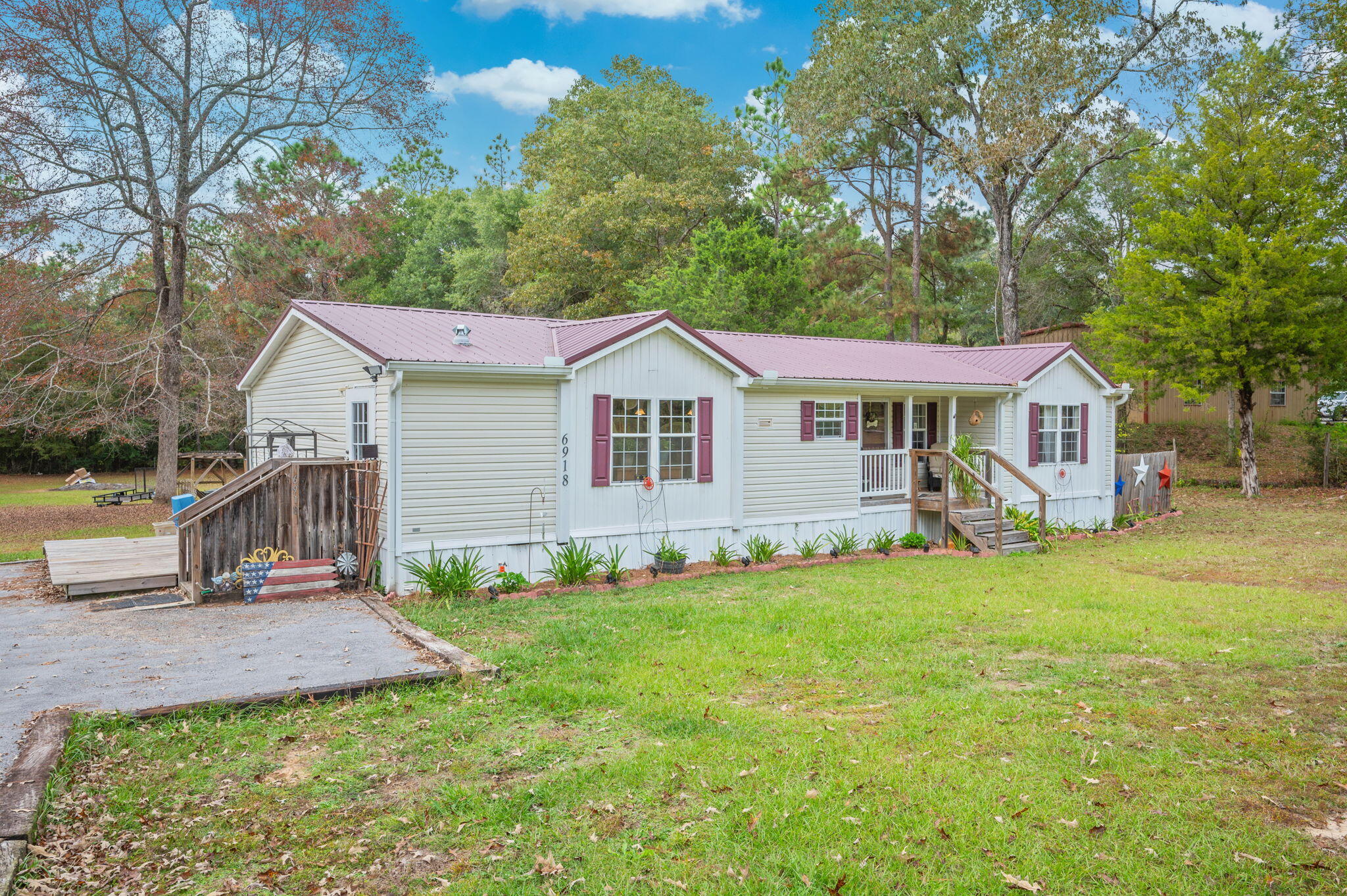 6918 Bill Lundy Road Laurel Hill, FL 32567 - Photo 3 of 27 a view of a yard in front of house