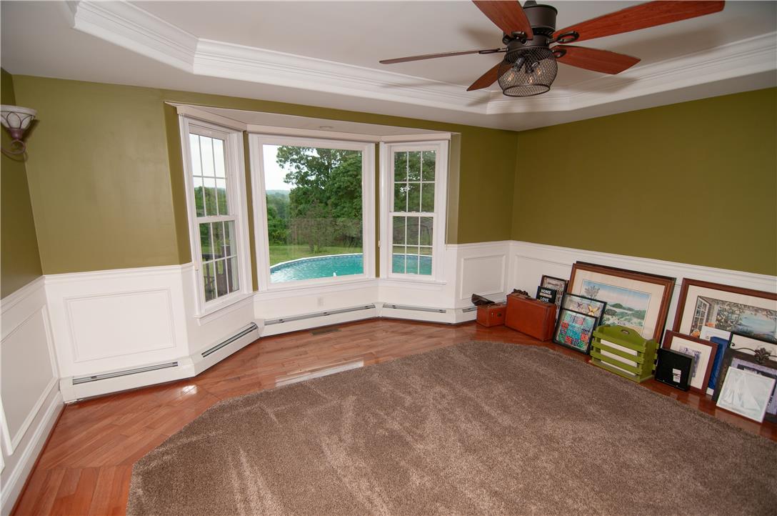 2202 High Meadow Road Coopersburg, PA 18036 - Photo 14 of 41 Polished hardwood flooring and detailed wainscoting highlight this versatile space featuring a classic bay window.