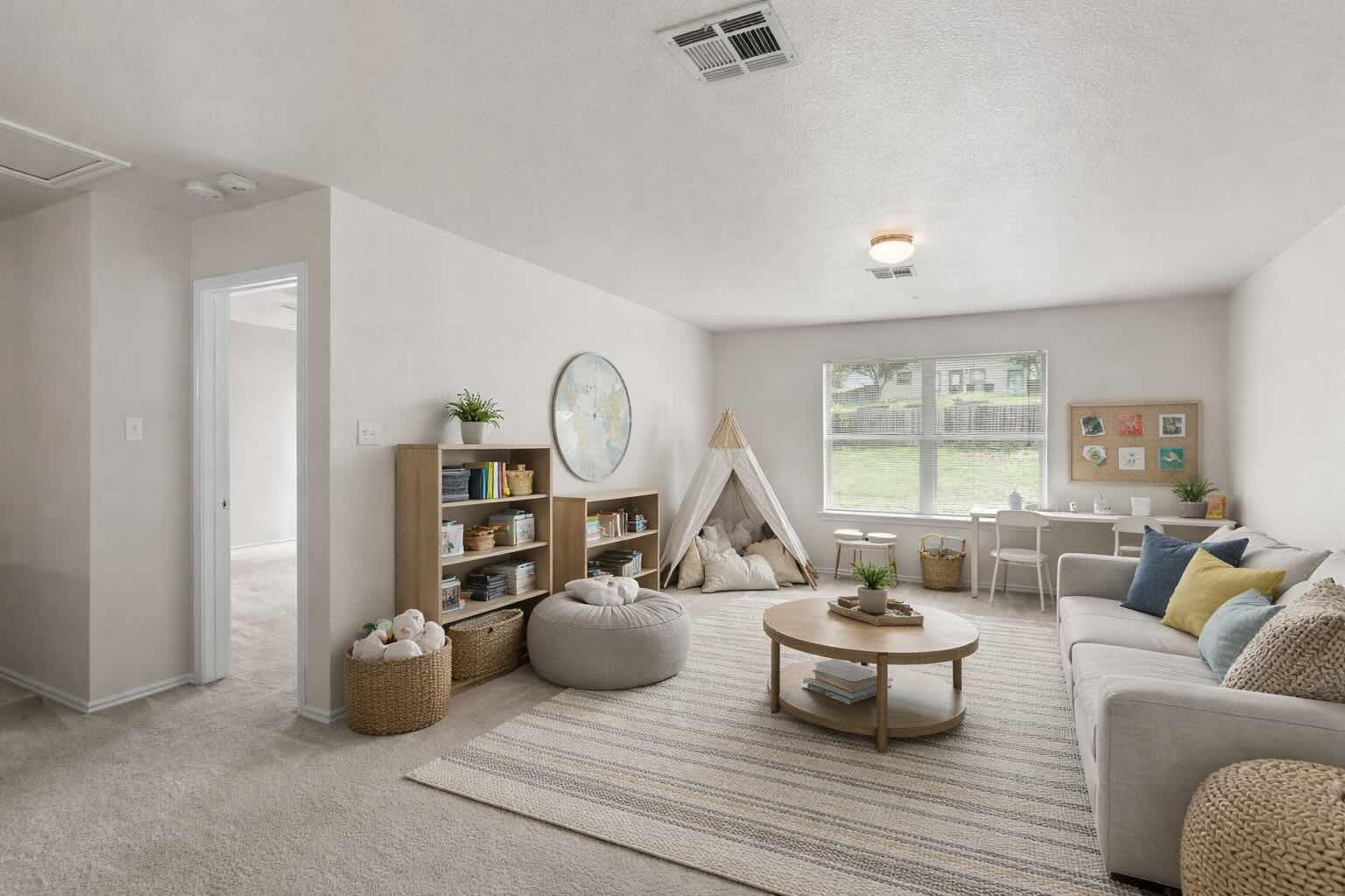 208 Dandelion Loop Kyle, TX 78640 - Photo 6 of 39 Virtually Staged - Spacious upstairs secondary living area featuring neutral carpeting, recessed lighting, and a large window providing ample natural light