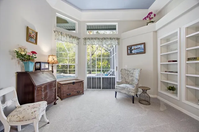 a spacious bathroom with a granite countertop sink and a mirror