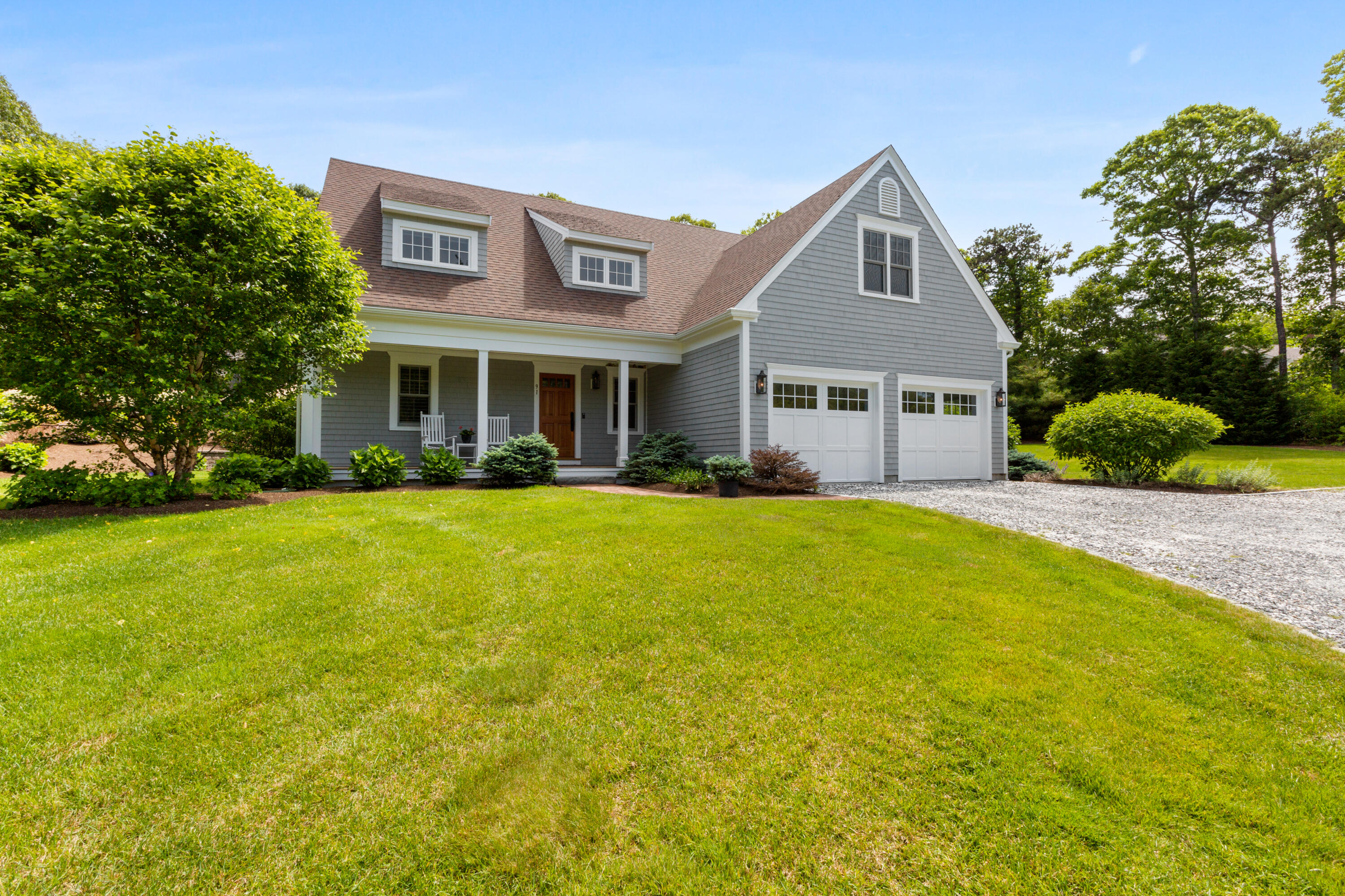 91 Pochet Road Orleans, MA 02653 - Photo 14 of 77 a front view of house with yard and green space