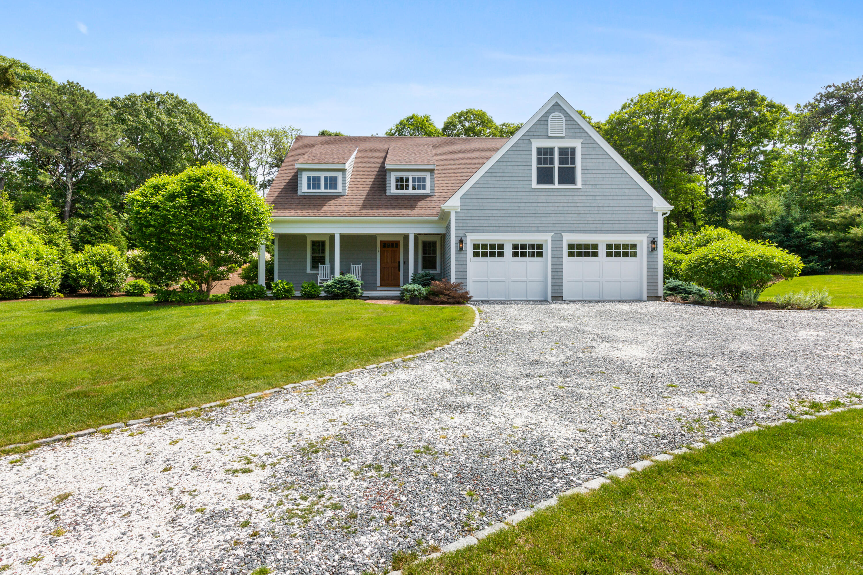 91 Pochet Road Orleans, MA 02653 - Photo 5 of 77 a front view of a house with garden