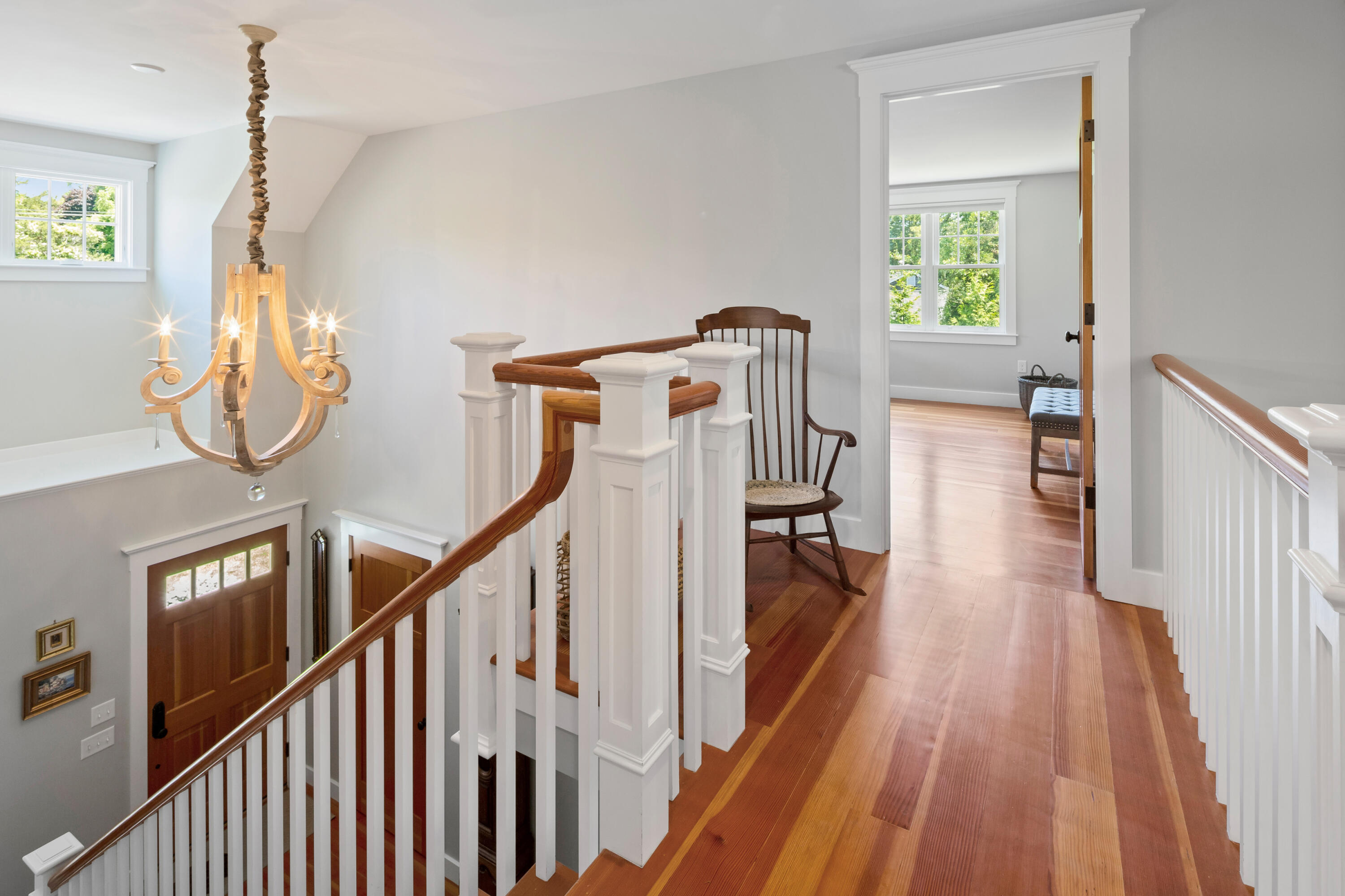 91 Pochet Road Orleans, MA 02653 - Photo 53 of 77 a view of a livingroom with wooden floor and stairs