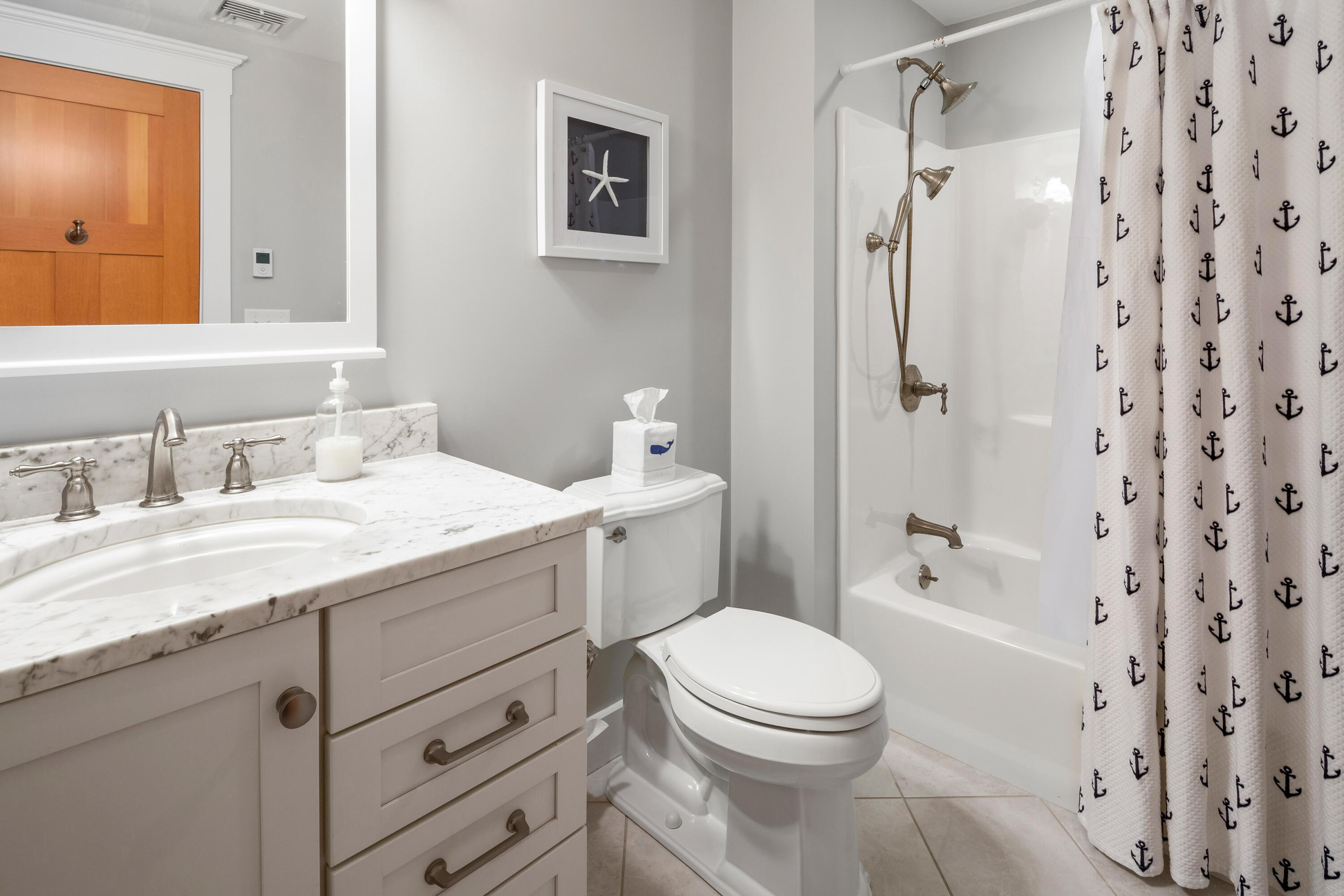 91 Pochet Road Orleans, MA 02653 - Photo 61 of 77 a bathroom with a granite countertop sink toilet and shower