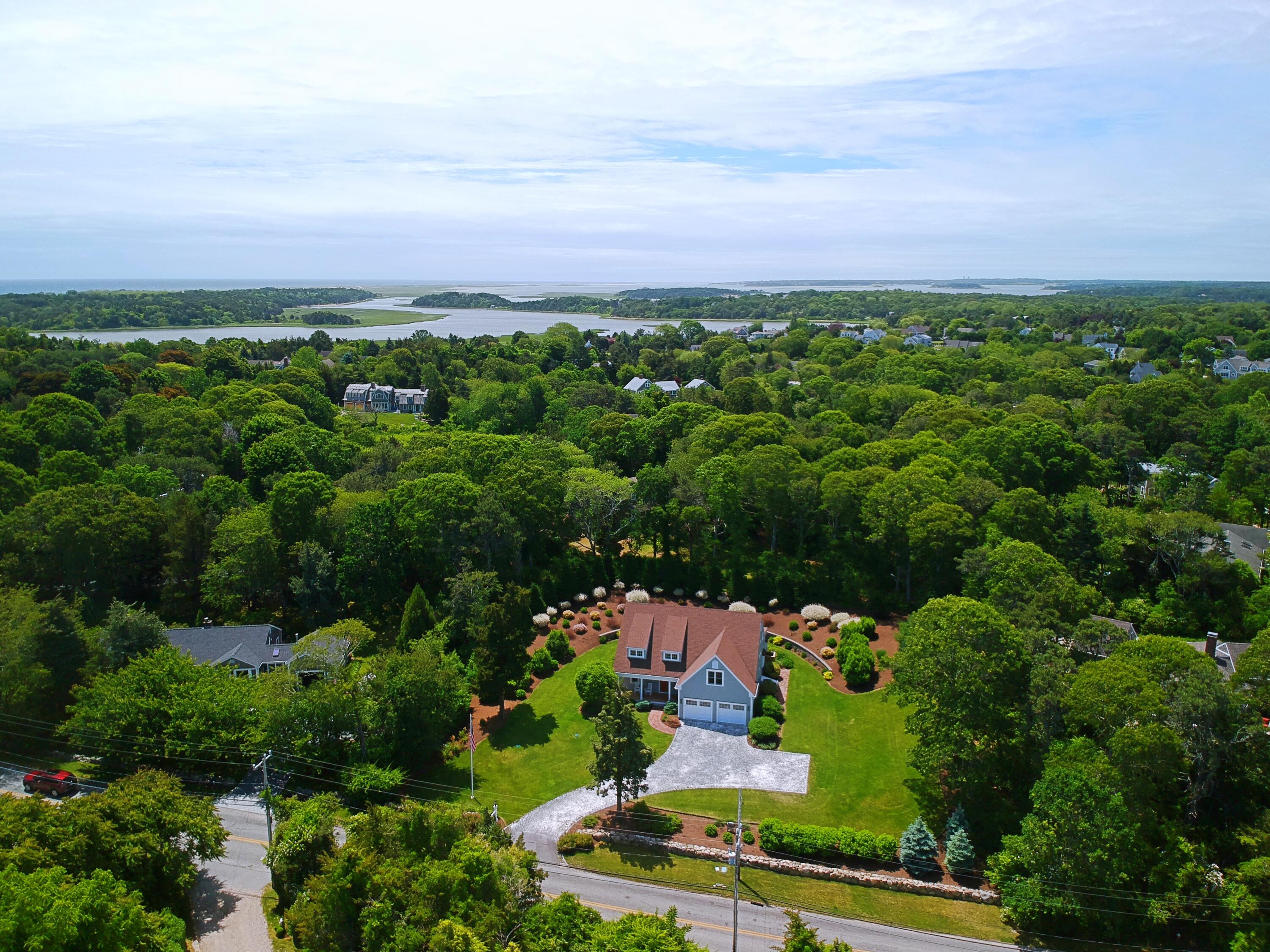 91 Pochet Road Orleans, MA 02653 - Photo 7 of 77 an aerial view of a city with lots of residential buildings and mountain view in back