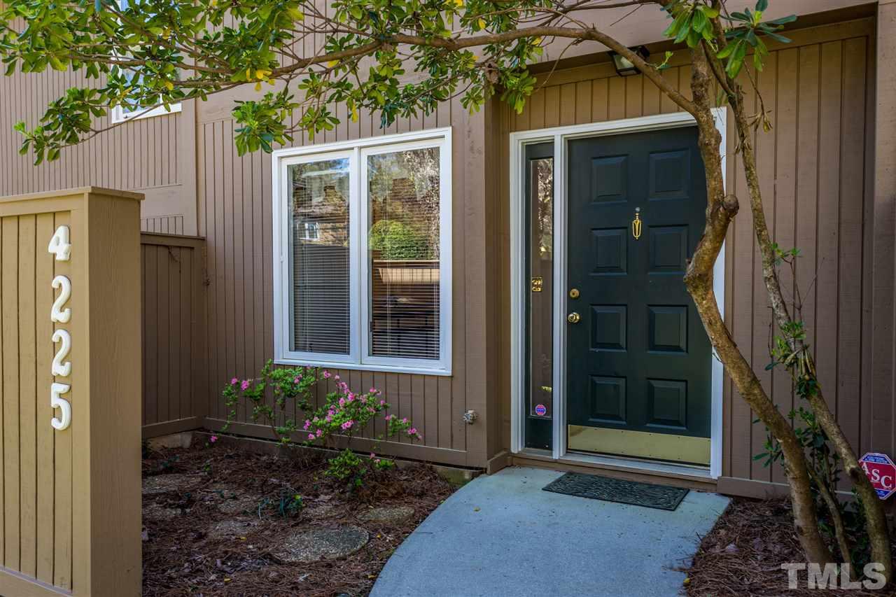 4225 Sunscape Lane Raleigh, NC 27613 - Photo 2 of 23 a front view of a house with a yard