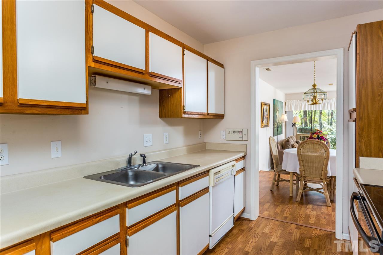 4225 Sunscape Lane Raleigh, NC 27613 - Photo 11 of 23 a kitchen that has a sink and cabinets
