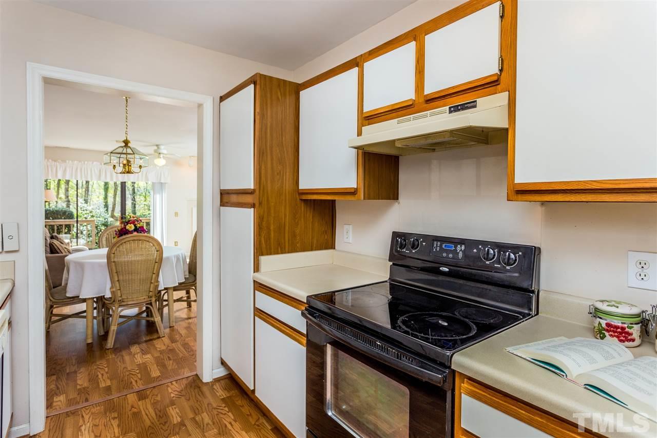 4225 Sunscape Lane Raleigh, NC 27613 - Photo 12 of 23 a kitchen with a stove and a cabinet