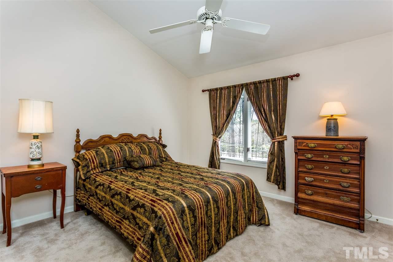 4225 Sunscape Lane Raleigh, NC 27613 - Photo 15 of 23 a bedroom with a bed and a window