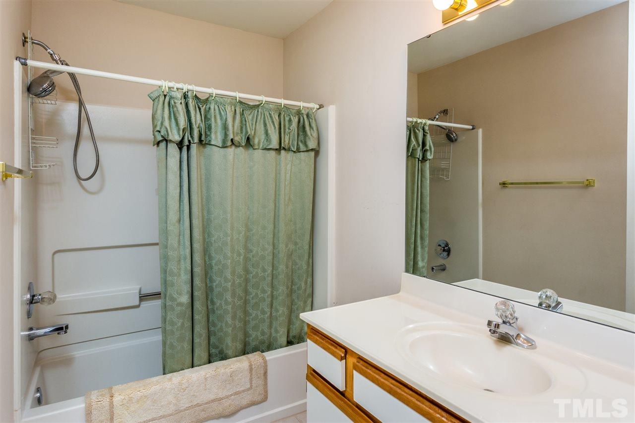 4225 Sunscape Lane Raleigh, NC 27613 - Photo 17 of 23 a bathroom with a sink toilet and shower