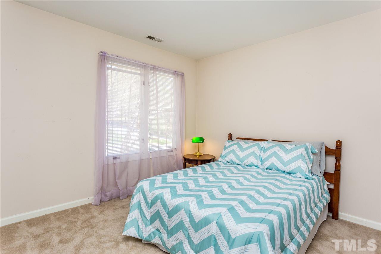 4225 Sunscape Lane Raleigh, NC 27613 - Photo 18 of 23 a bedroom with a bed and a window