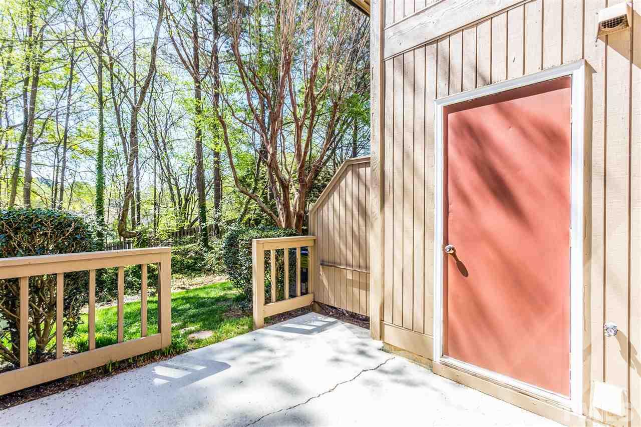 4225 Sunscape Lane Raleigh, NC 27613 - Photo 20 of 23 a view of a house with a large window and wooden fence