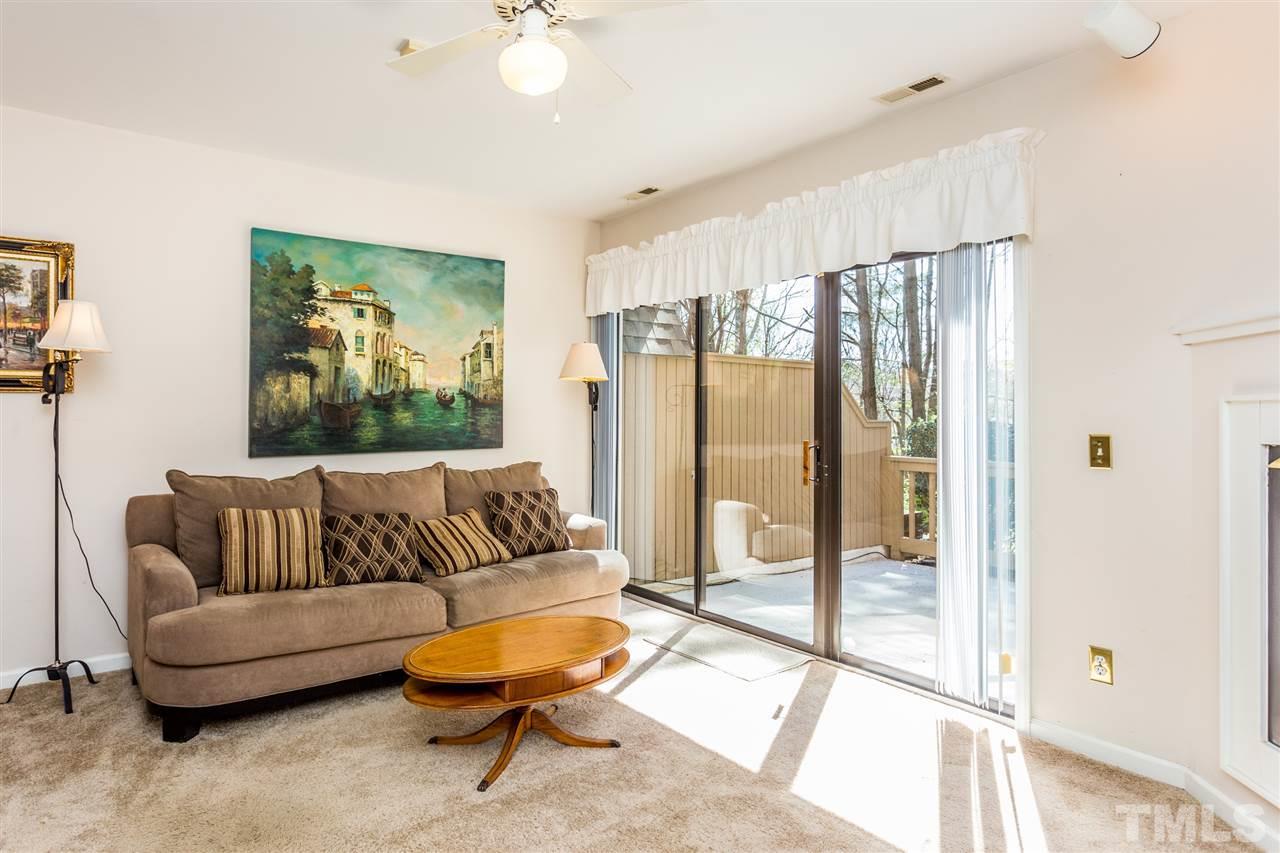 4225 Sunscape Lane Raleigh, NC 27613 - Photo 3 of 23 a living room with furniture and a large window