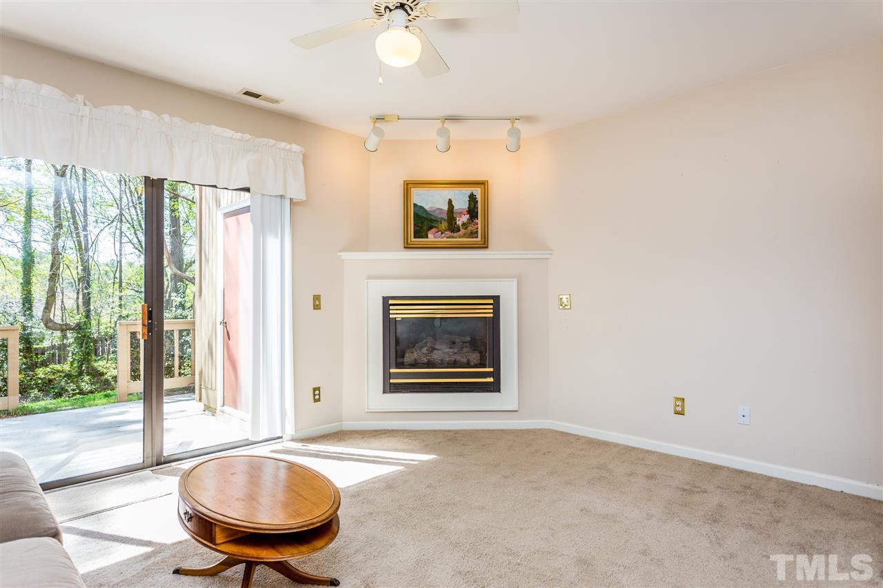 4225 Sunscape Lane Raleigh, NC 27613 - Photo 5 of 23 a living room with furniture and a fireplace