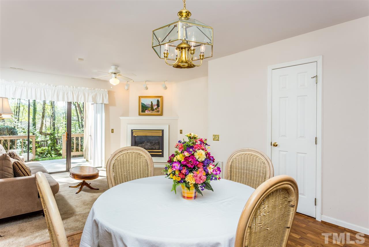 4225 Sunscape Lane Raleigh, NC 27613 - Photo 8 of 23 a bedroom with furniture and a chandelier