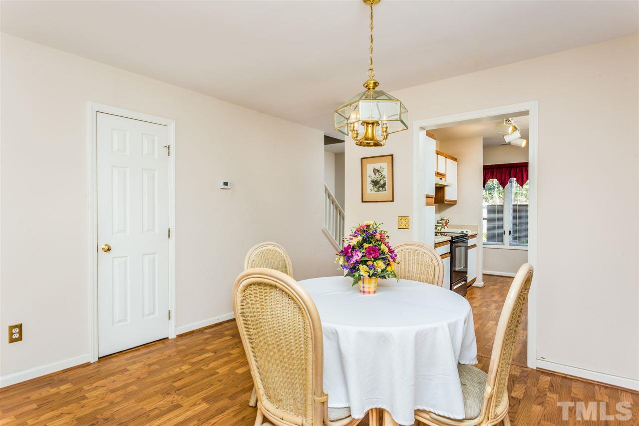 4225 Sunscape Lane Raleigh, NC 27613 - Photo 10 of 23 a view of a dining room with a table and chairs