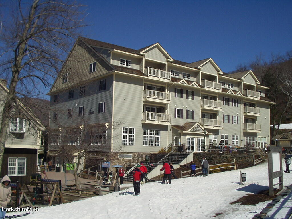 a front view of a building with many windows