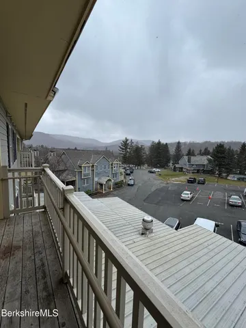 a terrace with outdoor seating and city view