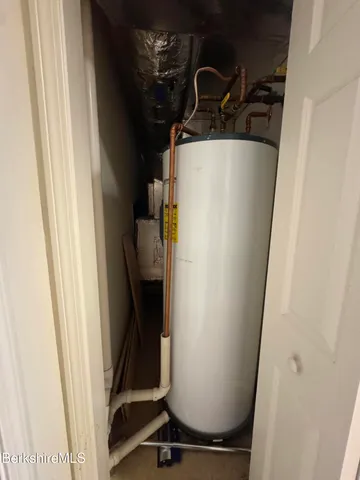 a view of closet with wooden floor