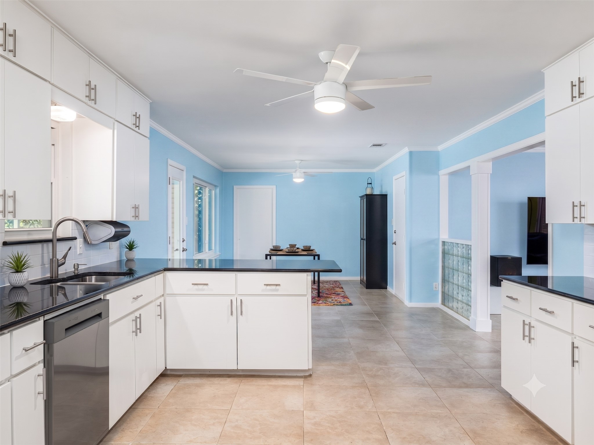 4710 Frontier Trail Austin, TX 78745 - Photo 7 of 32 a large white kitchen with a stove top oven and cabinets