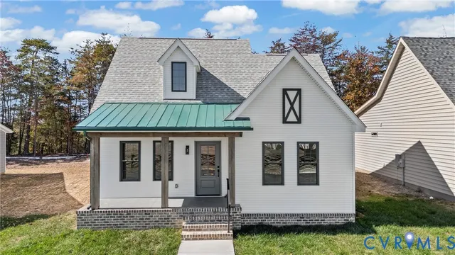 a view of house with yard