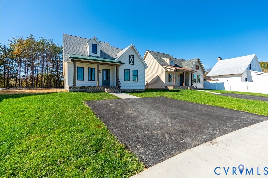 203 Zion Drive Farmville, VA 23901 - Photo 19 of 20 a front view of a house with a yard and garage