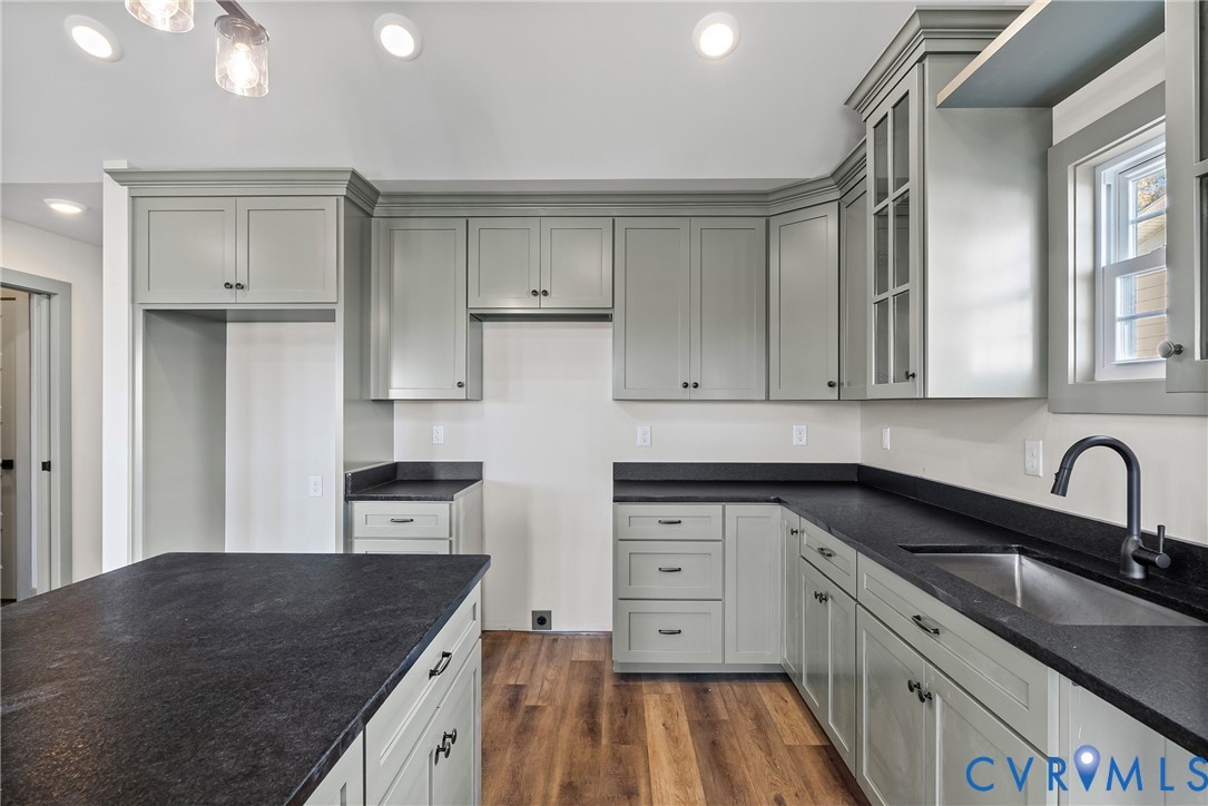 203 Zion Drive Farmville, VA 23901 - Photo 6 of 20 a kitchen with granite countertop a sink stove and cabinets